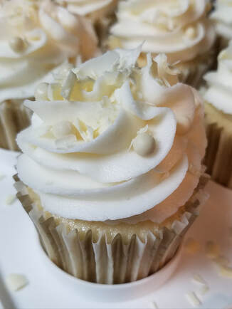 White Cake Cupcakes with Vanilla Buttercream and White Chocolate Accents